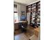 Well-lit office featuring custom bookshelves and a desk, perfect for a home workspace at 3098 W 39Th Ave, Denver, CO 80211