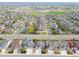 Aerial view of a residential neighborhood showing well-maintained homes, lawns, and a local school at 5362 E 140Th Pl, Thornton, CO 80602