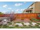 A backyard featuring raised garden beds, stepping stones, and an inviting outdoor space at 5362 E 140Th Pl, Thornton, CO 80602