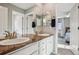 Bright bathroom with double sinks, modern fixtures, and a view to the primary bedroom at 5362 E 140Th Pl, Thornton, CO 80602