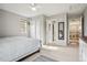 Spacious bedroom with a walk-in closet, featuring neutral tones and plenty of natural light at 5362 E 140Th Pl, Thornton, CO 80602