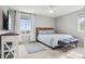 Cozy bedroom with ample natural light, featuring a comfortable bed and a scenic view from the window at 5362 E 140Th Pl, Thornton, CO 80602