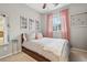 Comfortable bedroom with neutral décor and bright natural light at 5362 E 140Th Pl, Thornton, CO 80602