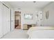 A serene bedroom with a neutral palette, featuring a TV and a cozy ambiance at 5362 E 140Th Pl, Thornton, CO 80602