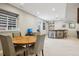 Basement dining area with a wood table and chairs adjoins the bar area at 5362 E 140Th Pl, Thornton, CO 80602