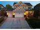 Beautiful home featuring a well-lit three car garage, stylish exterior, and inviting porch at 5362 E 140Th Pl, Thornton, CO 80602
