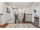 Upstairs hallway showcasing hardwood floors, decorative art, and access to multiple bedrooms at 5362 E 140Th Pl, Thornton, CO 80602