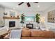 Cozy living room showcasing a fireplace, hardwood floors, neutral walls, and comfortable sofa seating at 5362 E 140Th Pl, Thornton, CO 80602