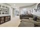 Spacious living room with comfortable seating, open floor plan and staircase at 5362 E 140Th Pl, Thornton, CO 80602