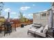 Outdoor patio with comfortable seating, a fire pit, and a dining area for outdoor enjoyment at 5362 E 140Th Pl, Thornton, CO 80602