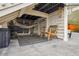 Cozy patio area under the deck of the home featuring an outdoor lounge space and hammock at 5362 E 140Th Pl, Thornton, CO 80602