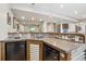 Finished basement has an amazing wet bar with wood accents and modern appliances at 5362 E 140Th Pl, Thornton, CO 80602