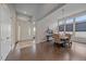 Elegant dining room featuring hardwood floors, high ceilings, and sophisticated chandelier lighting at 9433 Torrey Way, Arvada, CO 80007