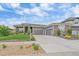 Beautiful single-Gathering home featuring a three-car garage and manicured landscaping at 9433 Torrey Way, Arvada, CO 80007