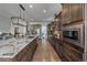 Contemporary kitchen with a long island, stainless steel appliances, and stylish cabinetry at 9433 Torrey Way, Arvada, CO 80007