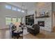 Inviting living room with a cozy fireplace and comfortable seating arrangement at 9433 Torrey Way, Arvada, CO 80007