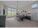 Spacious primary bedroom featuring high ceilings, large windows, and ample natural light at 9433 Torrey Way, Arvada, CO 80007