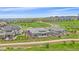 Stunning rear exterior with a covered patio, fenced yard, and stone accents in a beautiful community at 9433 Torrey Way, Arvada, CO 80007