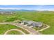 Stunning rear exterior with a covered patio, fenced yard, and stone accents in a beautiful community at 9433 Torrey Way, Arvada, CO 80007