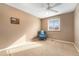 Cozy bedroom with a chair, window, and neutral carpet at 11362 W Frost Ave, Littleton, CO 80127