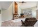 Warm and inviting living room featuring a cozy fireplace and comfortable seating area at 11362 W Frost Ave, Littleton, CO 80127