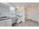 Elegant bathroom with dual sinks, tile flooring, and a glass-enclosed shower at 24704 E Pacific Pl, Aurora, CO 80018