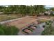 Aerial view of equestrian area, showing a large horse area, fencing, and garden beds, showing country property at 7130 Independence St, Arvada, CO 80004