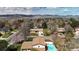Spacious suburban home with a pool, complemented by scenic mountain views in the distance at 7552 Miller Ct, Arvada, CO 80005