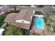 Aerial view of home featuring a spacious backyard, pool, patio, and lush landscaping at 7552 Miller Ct, Arvada, CO 80005