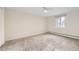 Spacious bedroom featuring neutral tones, carpet, and a window providing natural light at 7552 Miller Ct, Arvada, CO 80005