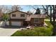 Inviting two-story home boasting a charming front yard and attached two-car garage at 7552 Miller Ct, Arvada, CO 80005
