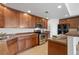 Modern kitchen with stainless steel appliances and granite countertops at 6232 Kilmer Loop # 204, Arvada, CO 80403