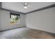 Bedroom with gray carpet, ceiling fan, and a view of the outdoors at 23730 E Otero Dr, Aurora, CO 80016