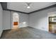 Spacious bedroom with gray carpet and recessed ceiling; adjoins the bathroom at 23730 E Otero Dr, Aurora, CO 80016