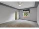 Bright carpeted bedroom with a ceiling fan and an exterior window at 23730 E Otero Dr, Aurora, CO 80016