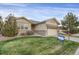 Charming single-Gathering home featuring a well-maintained lawn and inviting two-car garage at 23730 E Otero Dr, Aurora, CO 80016