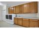 Laundry room with washer, dryer, sink, and cabinets at 23730 E Otero Dr, Aurora, CO 80016