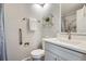 Updated bathroom features a modern vanity with sleek fixtures and a tub shower at 2729 E Geddes Pl, Centennial, CO 80122
