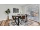 Elegant dining room with contemporary table, chic chairs, and a sliding glass door at 2729 E Geddes Pl, Centennial, CO 80122