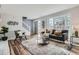 Bright living room with large windows, modern furnishings, and stylish decor at 2729 E Geddes Pl, Centennial, CO 80122