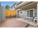 The private rear patio includes wood floors, a concrete pad, direct access to the home and privacy fencing at 2729 E Geddes Pl, Centennial, CO 80122