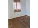 Bedroom featuring carpeted flooring and a window with sheer curtains at 3816 W Dakota Ave, Denver, CO 80219