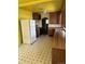 Kitchen with wood cabinets, and yellow wall color scheme at 3816 W Dakota Ave, Denver, CO 80219