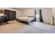 Bedroom with carpeted floors, a window, and dark curtains at 20530 Randolph Pl, Denver, CO 80249