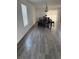 Dining room area featuring new laminate flooring and a view to an outside window at 20530 Randolph Pl, Denver, CO 80249