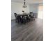 Dining room area with plenty of seating and featuring attractive laminate flooring at 20530 Randolph Pl, Denver, CO 80249