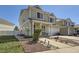 Inviting two-story home with a neatly landscaped front yard and a cozy front porch seating area at 20530 Randolph Pl, Denver, CO 80249