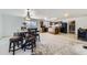 Spacious kitchen area with black appliances and view into the dining room and living room areas at 20530 Randolph Pl, Denver, CO 80249