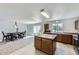 Open kitchen features an island, ample counter space, stainless steel appliances, and natural light at 20530 Randolph Pl, Denver, CO 80249
