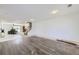 Spacious living room with newly installed hardwood floors and ample natural light. Great potential! at 20530 Randolph Pl, Denver, CO 80249